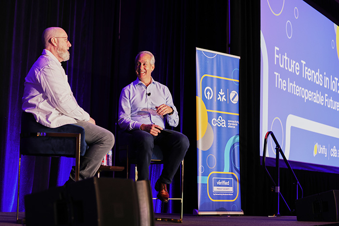 speakers onstage for future trends in IoT