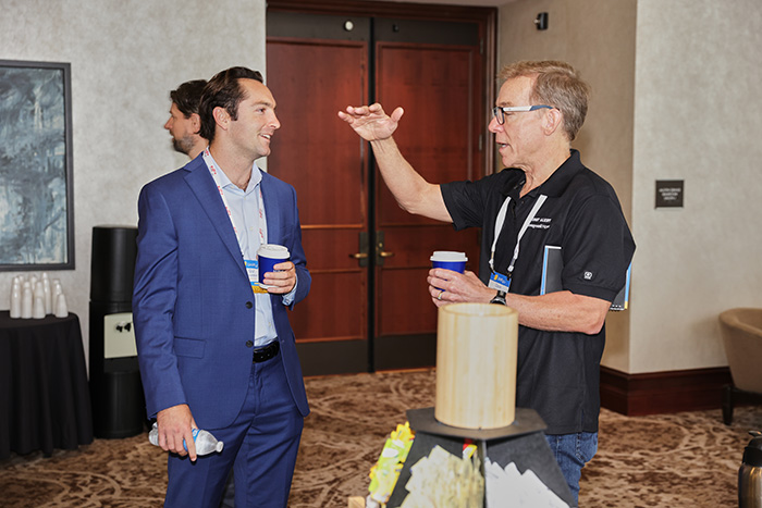 attendees interacting at networking breakfast.